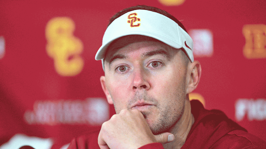 COLLEGE PARK, MARYLAND - OCTOBER 19: Head coach Lincoln Riley of the USC Trojans talks to the media after the game against at Maryland Terrapins at SECU Stadium on October 19, 2024 in College Park, Maryland. (Photo by G Fiume/Getty Images)