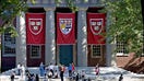 Harvard banners hang outside Memorial Church on the Harvard University campus in Cambridge, Massachusetts, on Friday, Sept. 4, 2009. 