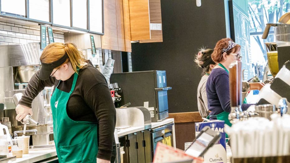 starbucks baristas serving customers