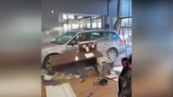 Angry customer crashes recently purchased Subaru through doors at dealership