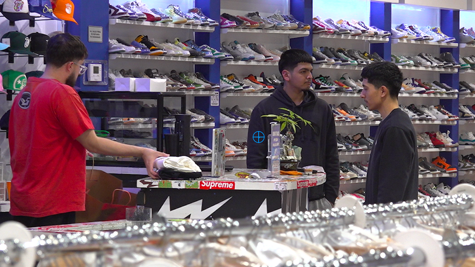 Two shoppers inside a shoe store