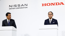 Makoto Uchida, Director, Representative Executive Officer, President and CEO of Nissan Motor Corporation and Toshihiro Mibe, Director, President and Representative Executive Officer of Honda, hold a joint press conference on their merger talks, in Tokyo, Japan, December 23, 2024.